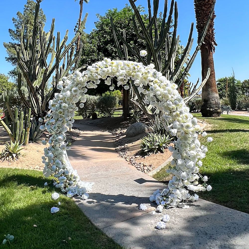 Outdoor flower arch installation by Dancing Wallflowers